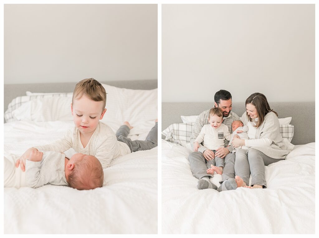 big brother looking at newborn on bed, family photo on bed newborn photo session Natick MA