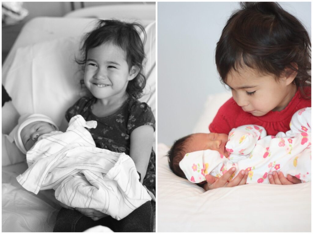 Natick toddler holding newborn baby sister photo