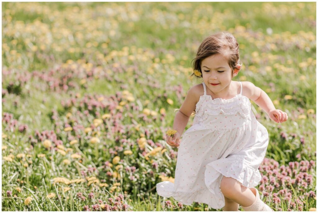 Girl runs through flower field photo Natick MA