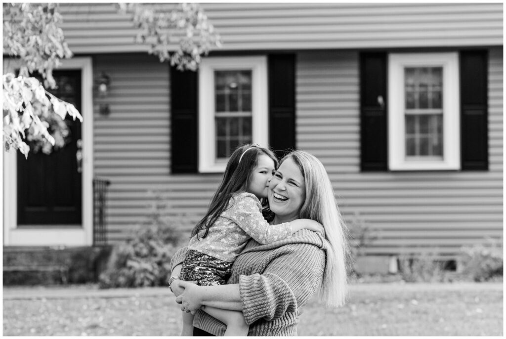 black and white photo of daughter kissing The Momming Worker Needham Massachusetts