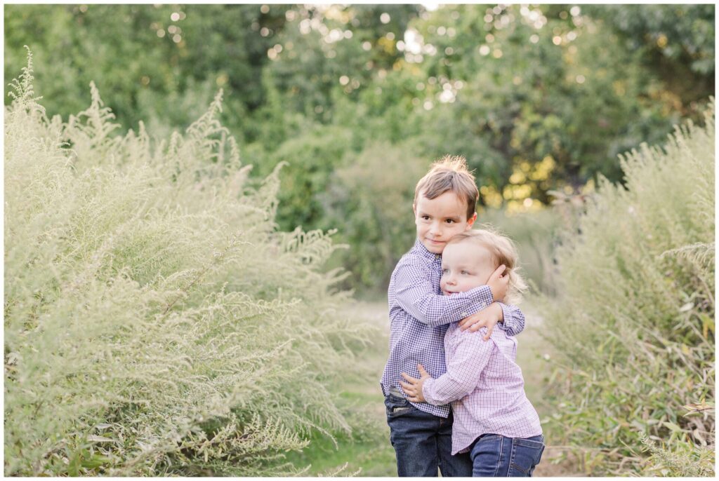 photo of brothers hugging in field in Newton Massachusetts