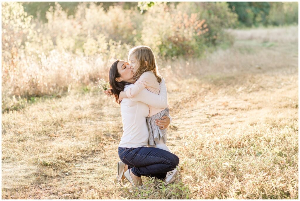Natick Massachusetts mom kisses daughter for family photo session