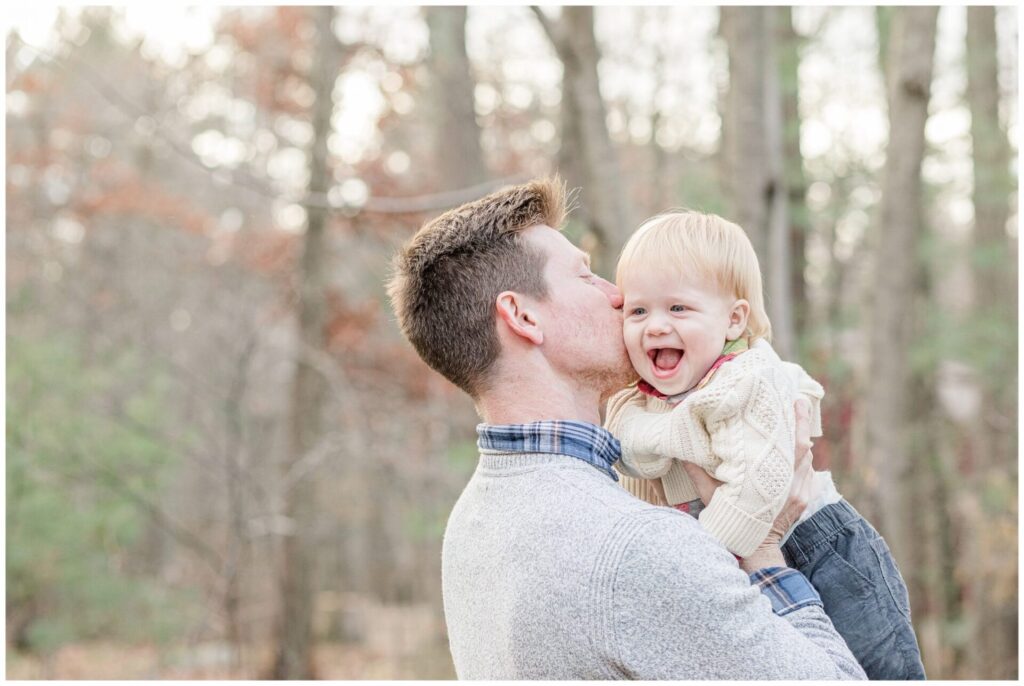 Dad kisses one year old for Medway Massachusetts Family Photo Session
