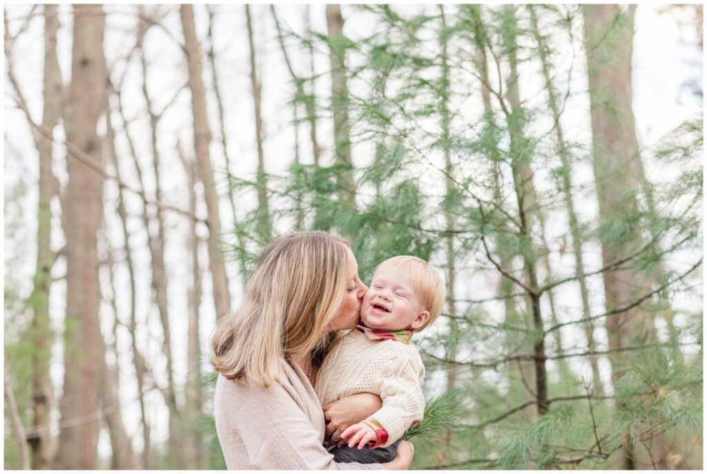 Mom kisses one year old son during Family photo session Medway MA