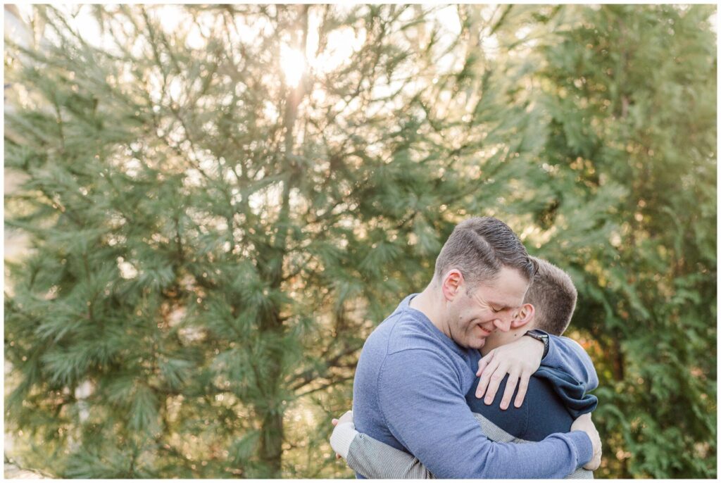 Photo of dad and son hugging for family photo session Photographer in Natick MA