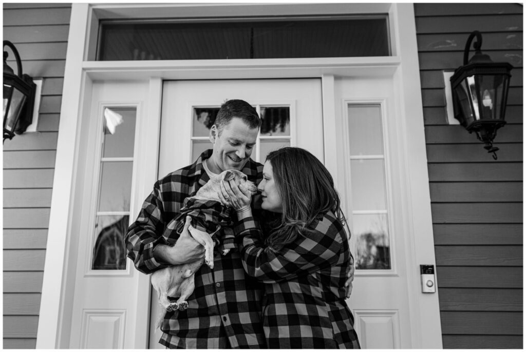 Black and white photo of couple and dog in matching pajamas photographer in Natick MA