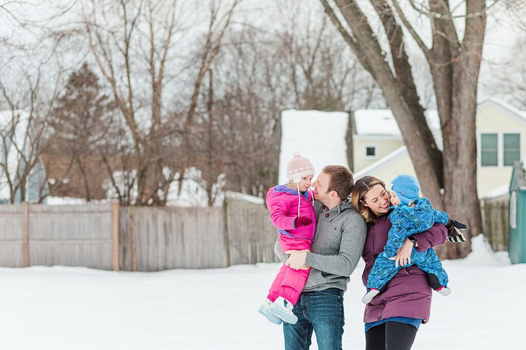 Family smiles together for photographer in Natick Massachusetts