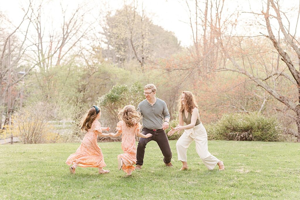 kids run towards parents during family photo session with Sara Sniderman Photography in Sherborn Massachusetts