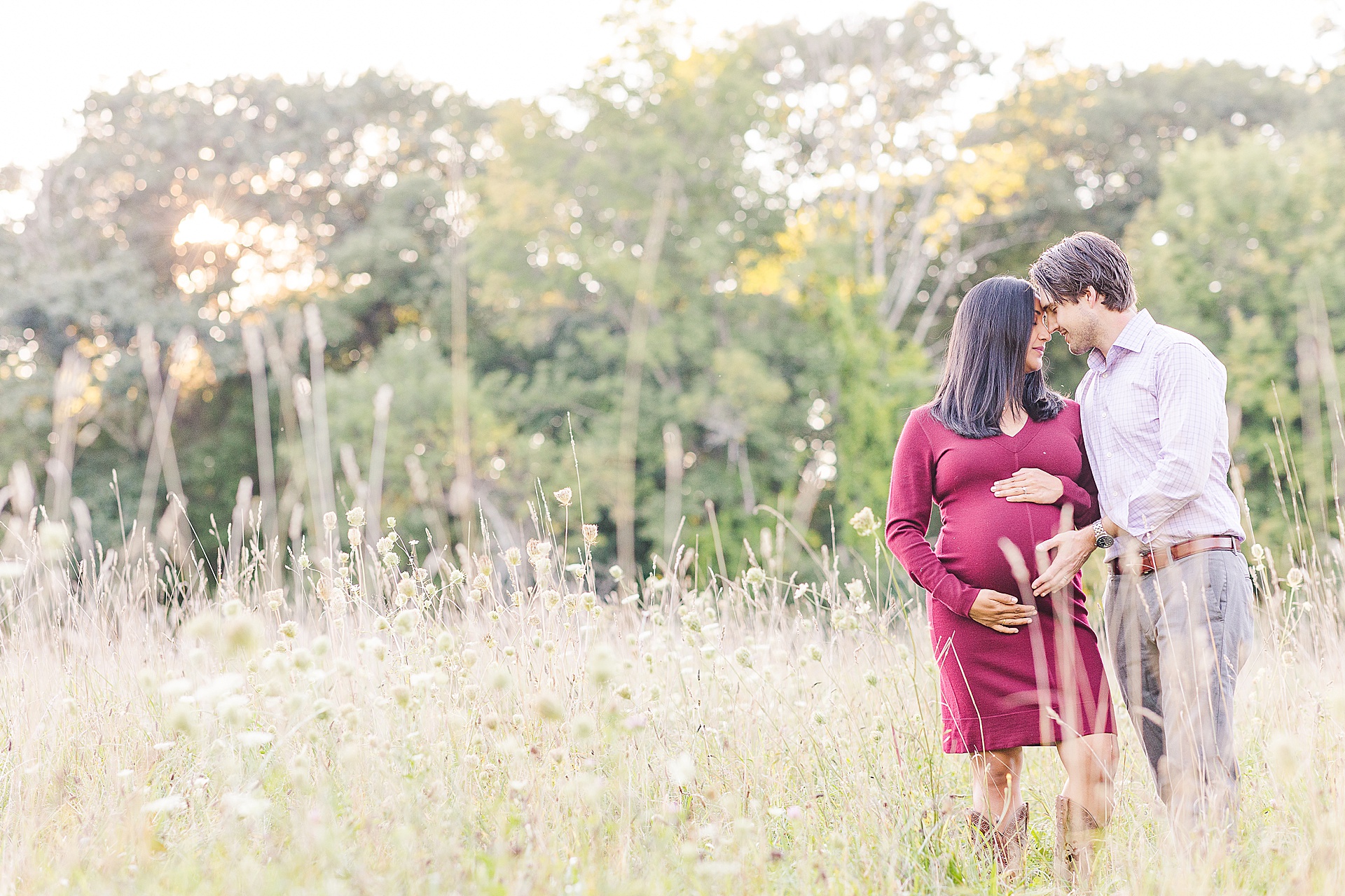 couple touch forheads during Maternity Photo Session with Sara Sniderman Photography at Head Farm in Wayland Massachusetts