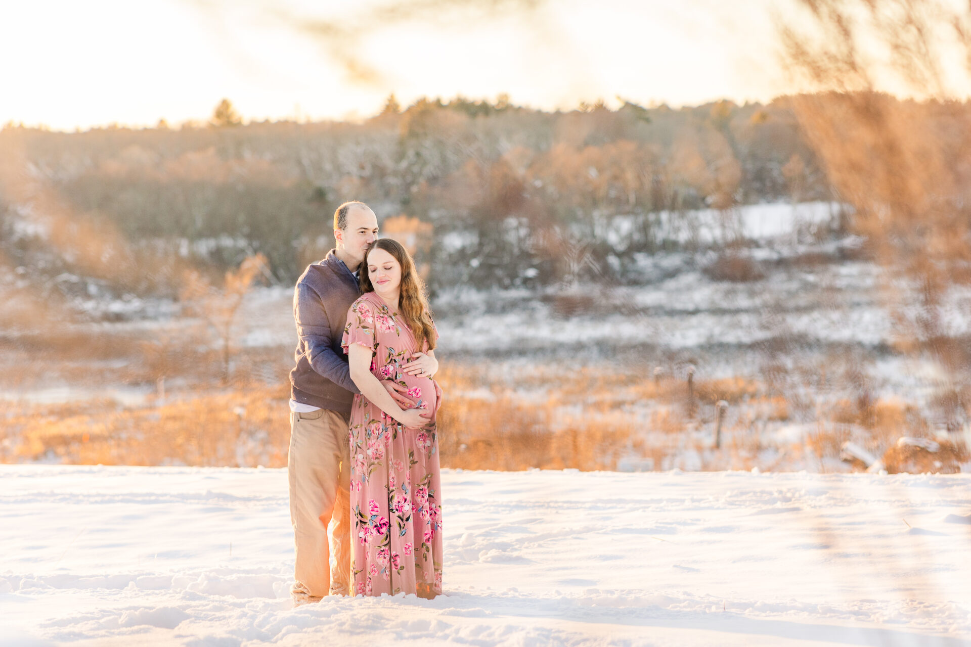 snowy winter maternity session with Sara Sniderman Photography at Medfield State Hospital in Medfield Massachusetts