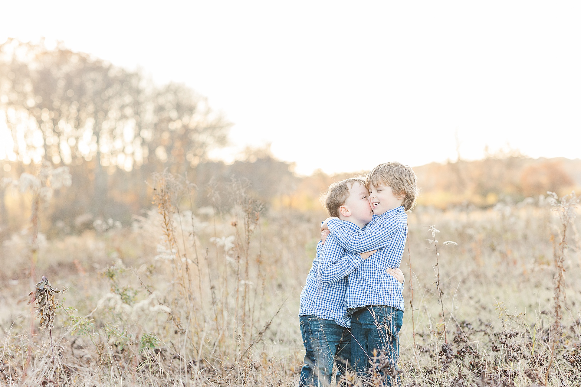 brothers hug during photo session with Sara Sniderman Photography at Cow Common, Wayland Massachusetts