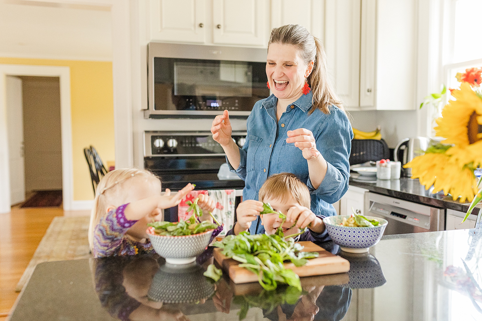 Mom cooks with kids during branding photo session with Sara Sniderman Photography for Burgeoning Bud Postpartum doula and Pediatric Sleep Consultant
