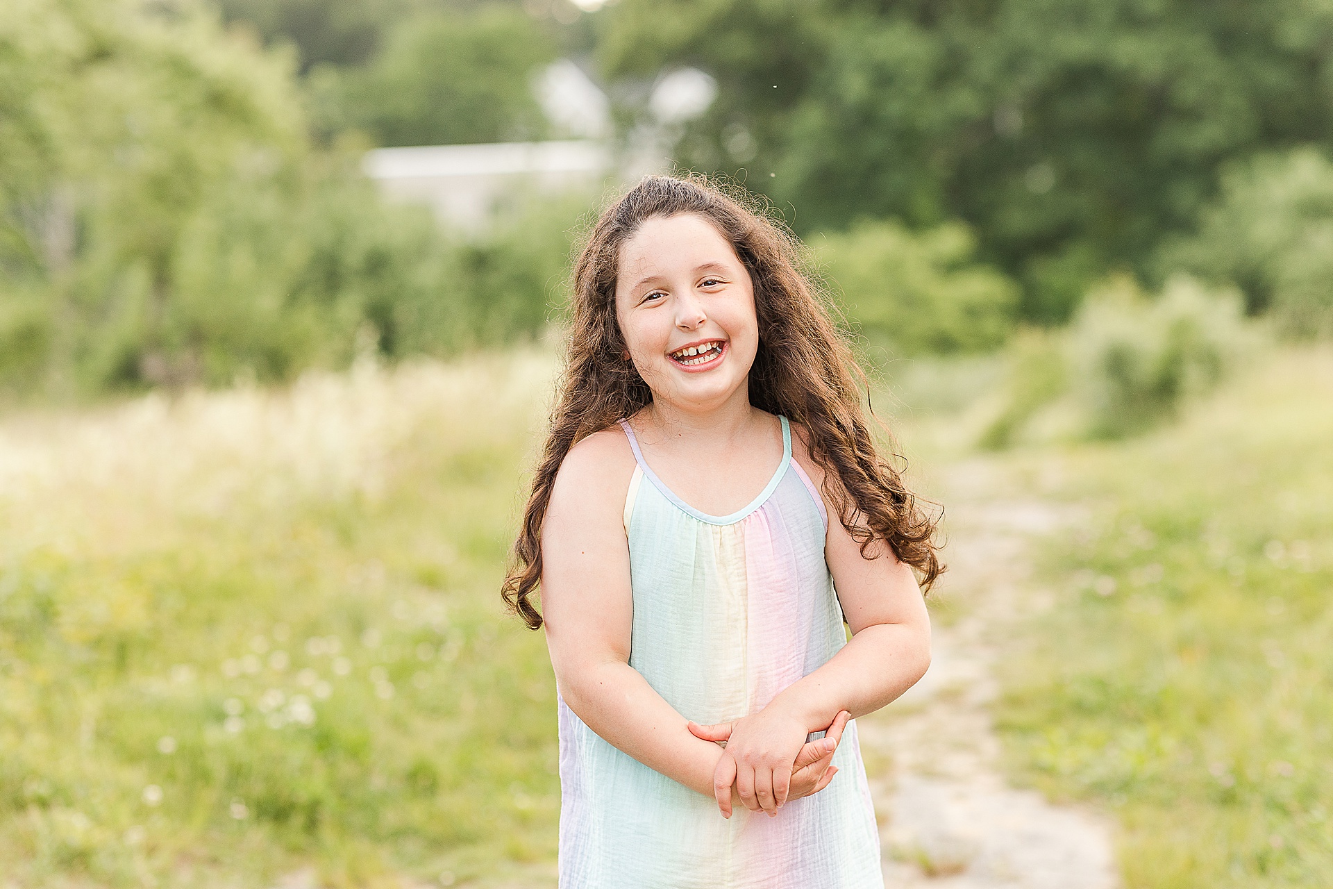 girl laughing during family photo session with Sara Sniderman Photography at Breakneck Hill Conservation Land, Southborough Massachusetts