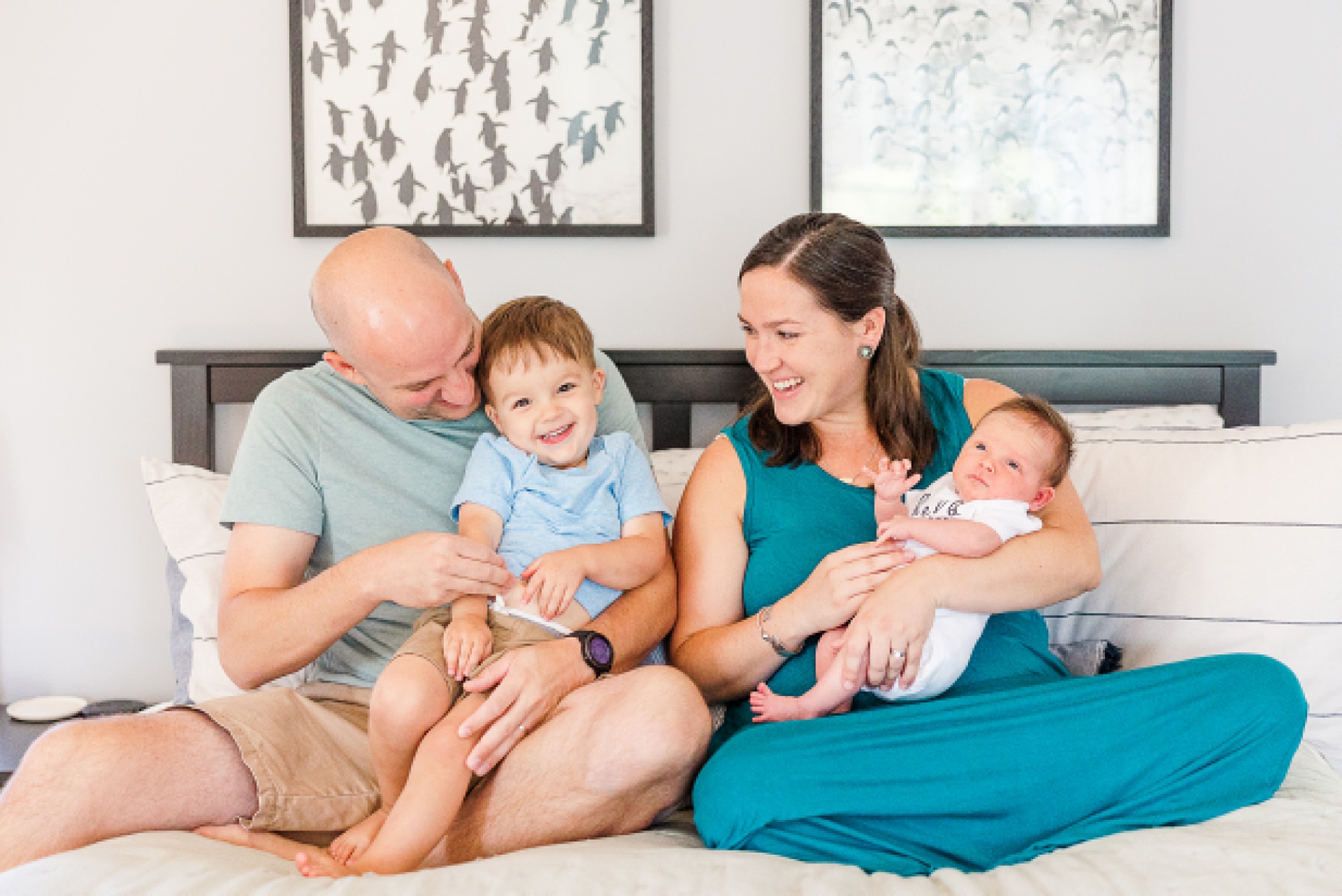 family snuggled during in home newborn session with Sara Sniderman Photography in Medway Massachusetts