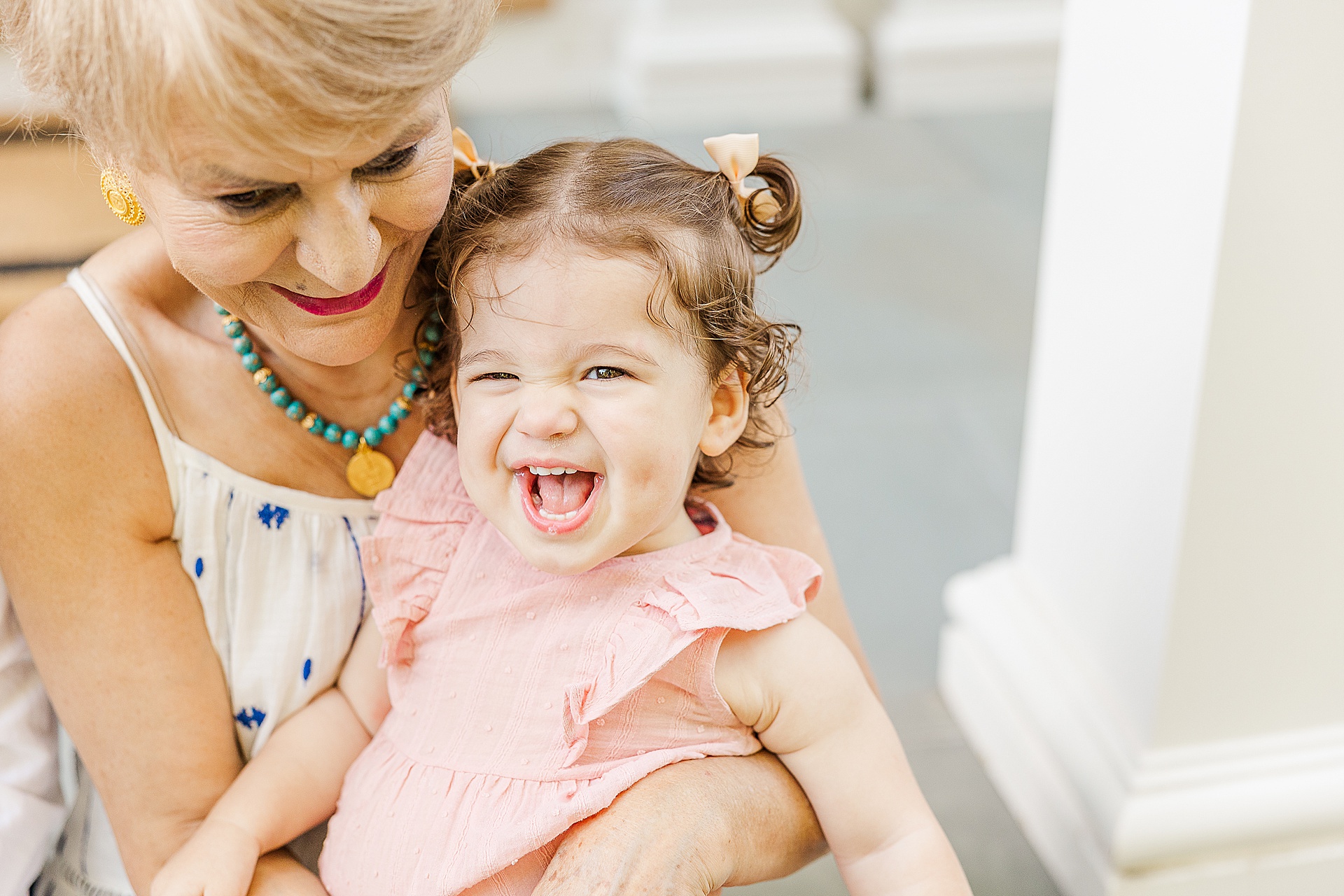 girl laughs with grandmother during family photo session with Sara Sniderman Photography in Newton Massachusetts