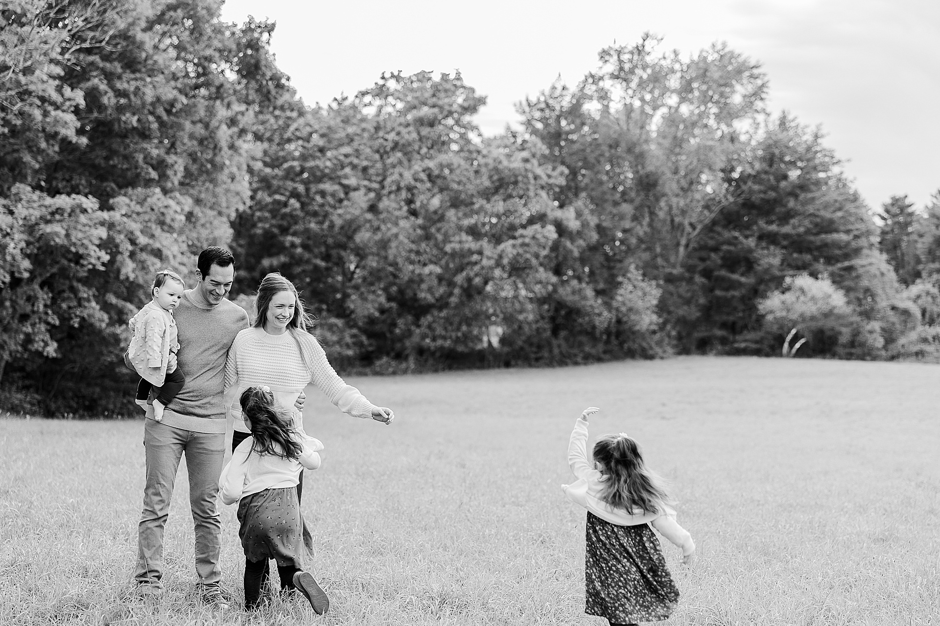 black and white photo of girls running to parents If you baby is awake the whole session or sleeps the whole session that is OK!  I will capture baby however they are in that moment :)