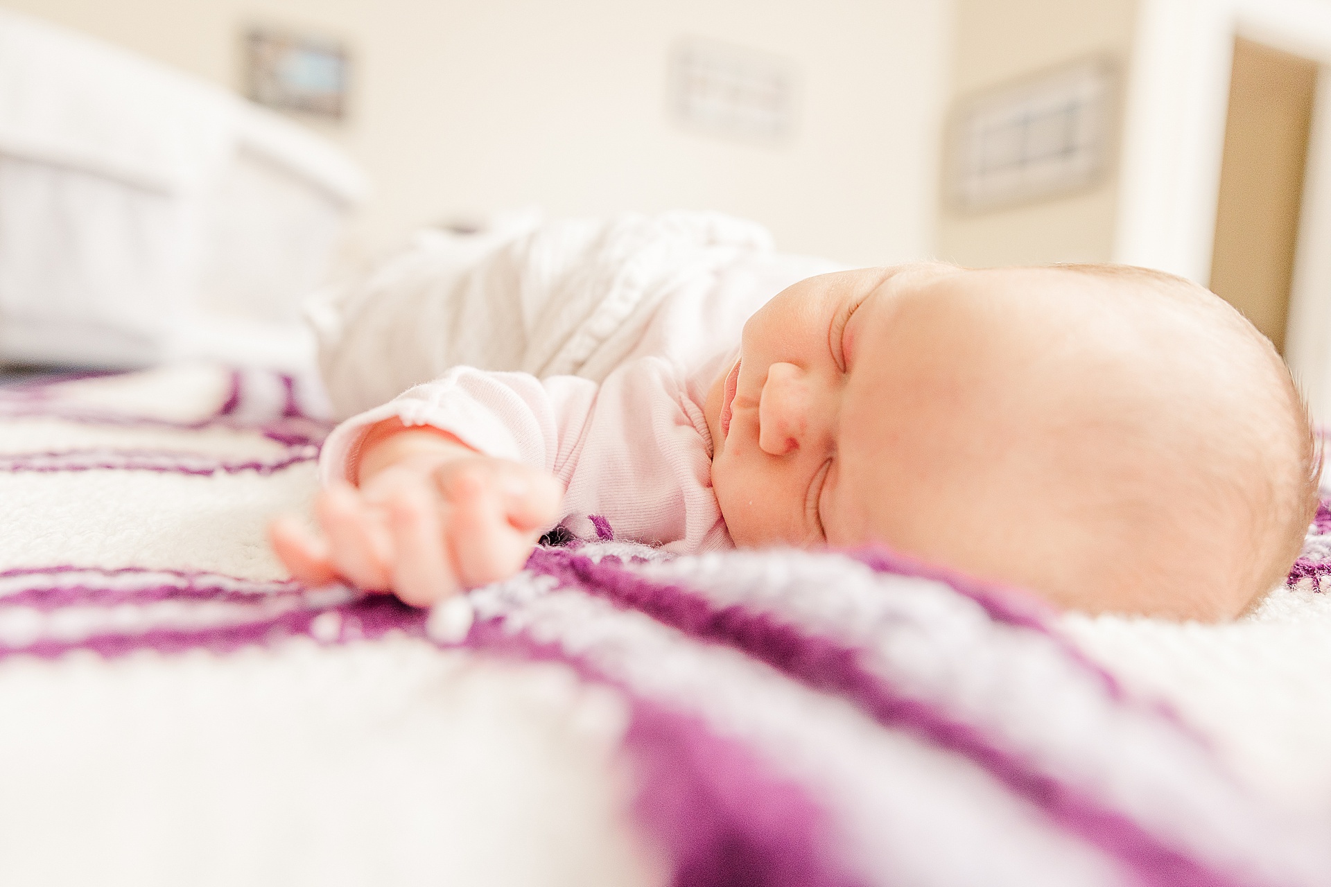 baby sleeps during in home newborn photo session with Sara Sniderman Photography in Wellesley Massachusetts