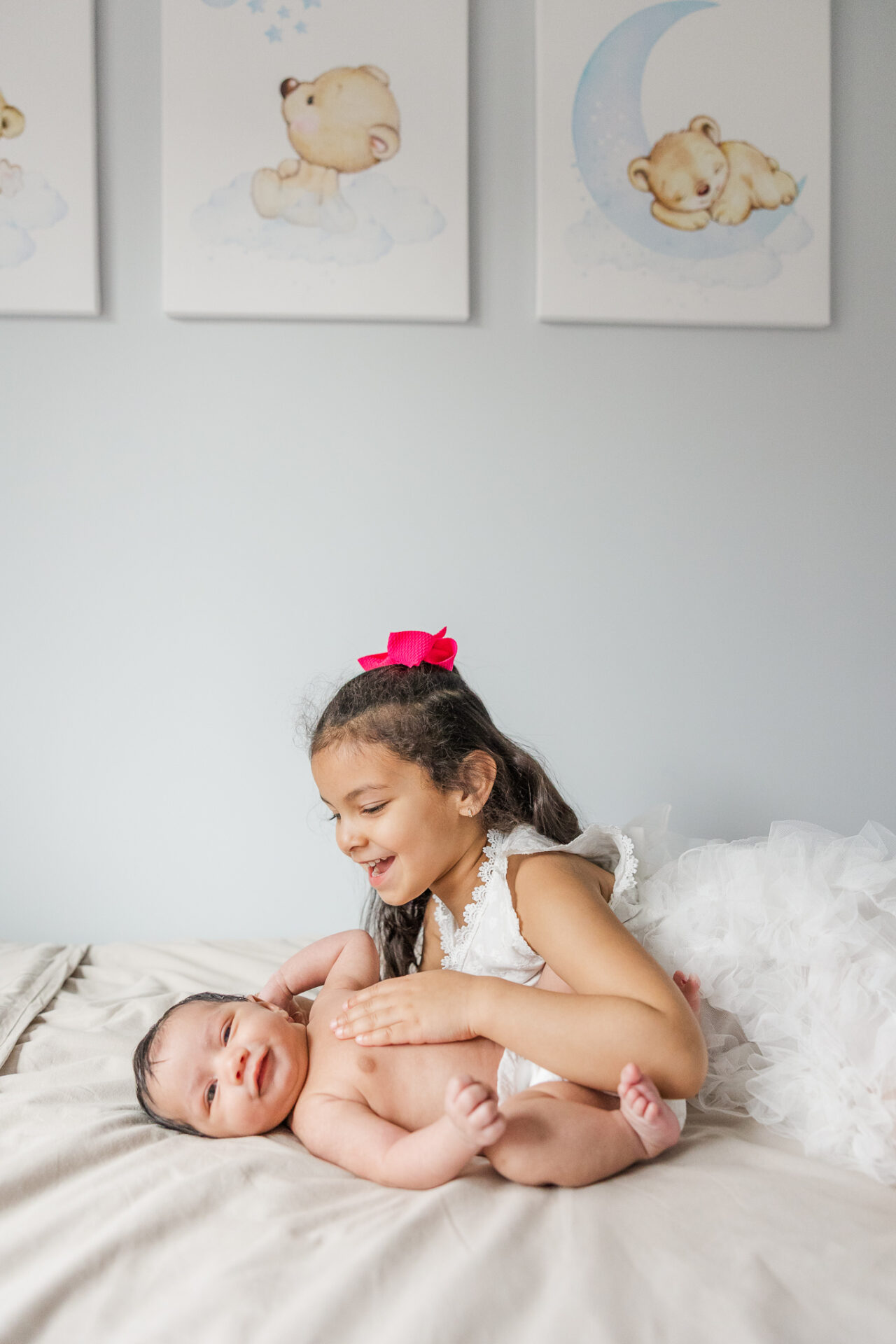 sweet sibling moments during in home newborn session in Natick MA with Sara Sniderman Photography