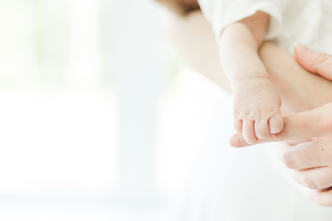 baby hand during in-home photo session in Millis Massachusetts with Sara Sniderman Photography