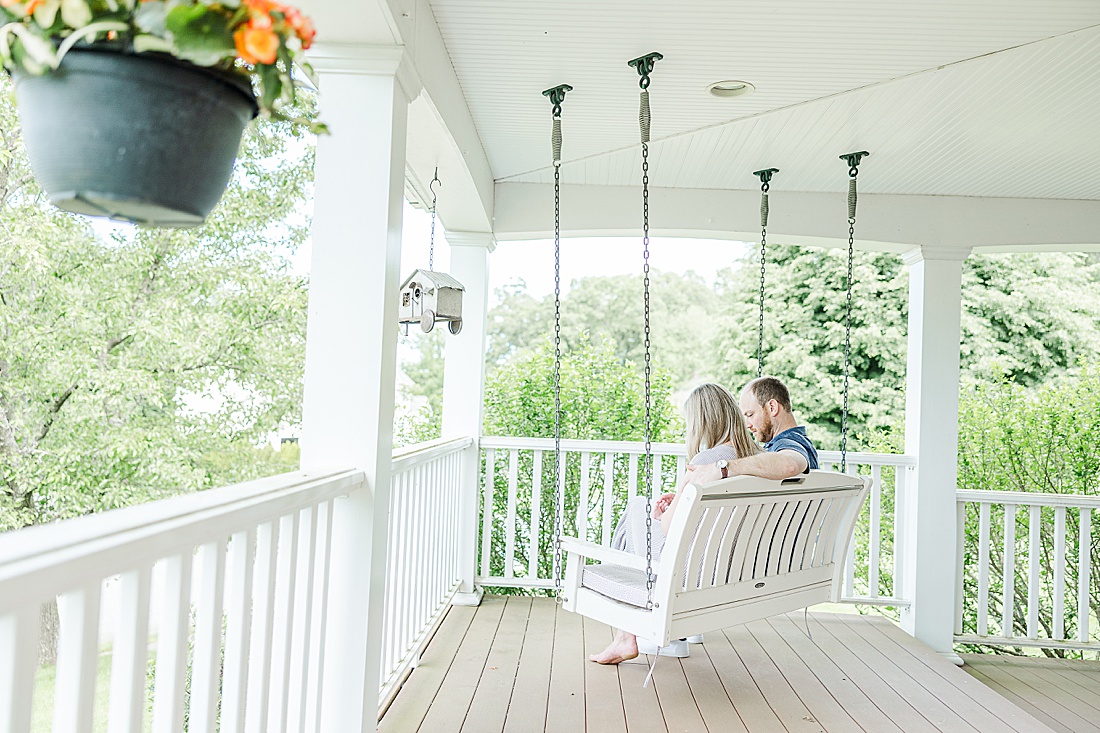 family on porch swing during in home family photo session with Sara Sniderman Photography in Metro West Boston