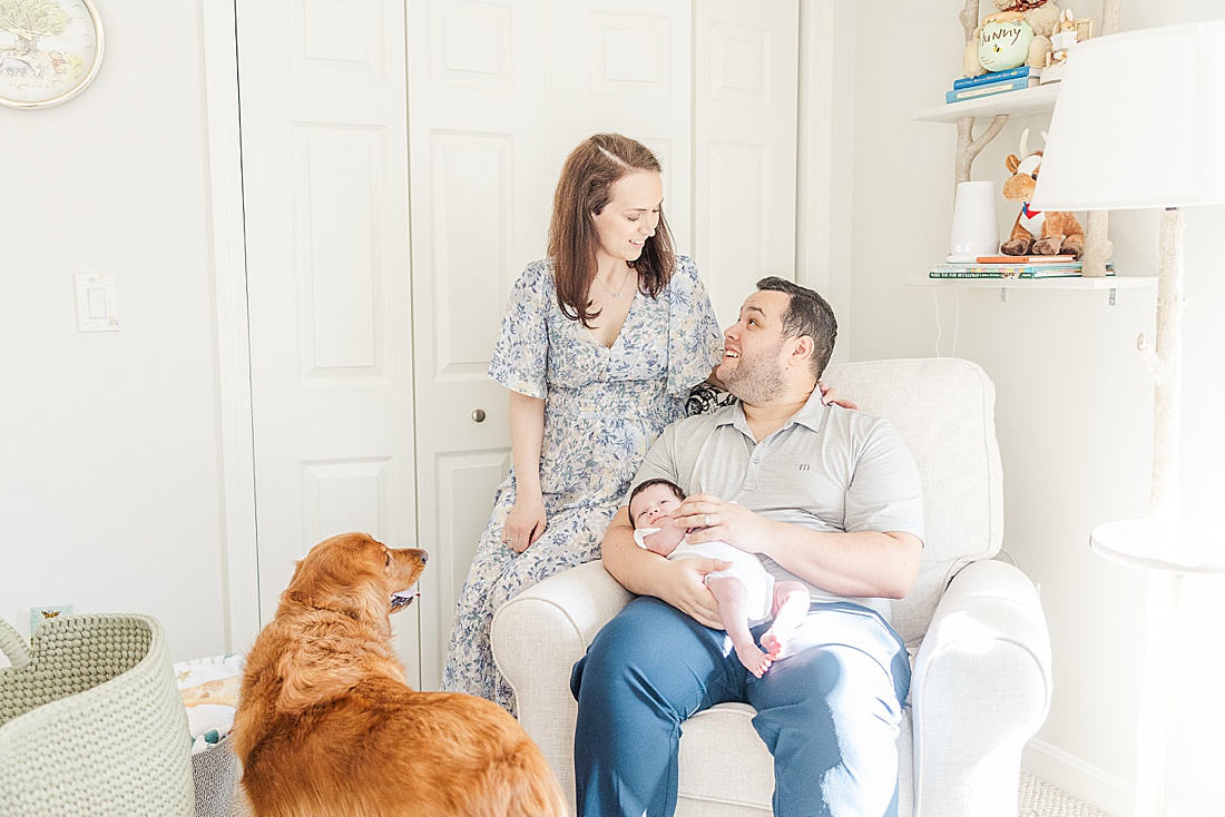 family and dog in nursery during in home family photo session with Sara Sniderman Photography in Metro West Boston