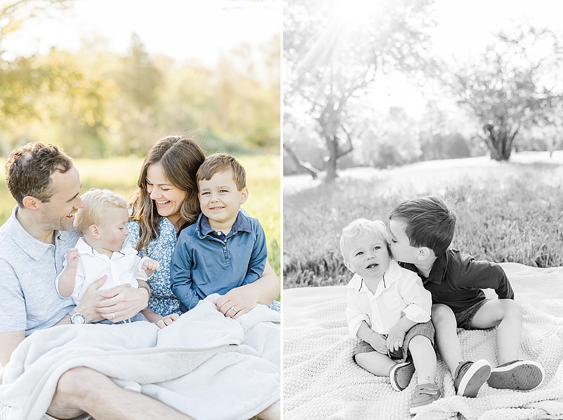 Mom cuddles sons and black and white of brothers kissing Spring Morning family photo session at Sprindale field in Dover Massachusetts with Sara Sniderman Photography. 