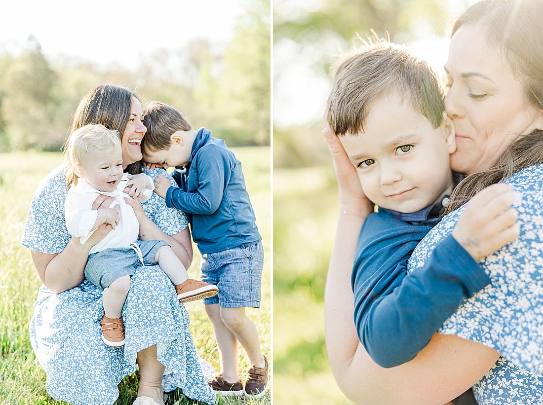 mom holds kids during Spring Morning family photo session at Sprindale field in Dover Massachusetts with Sara Sniderman Photography. 