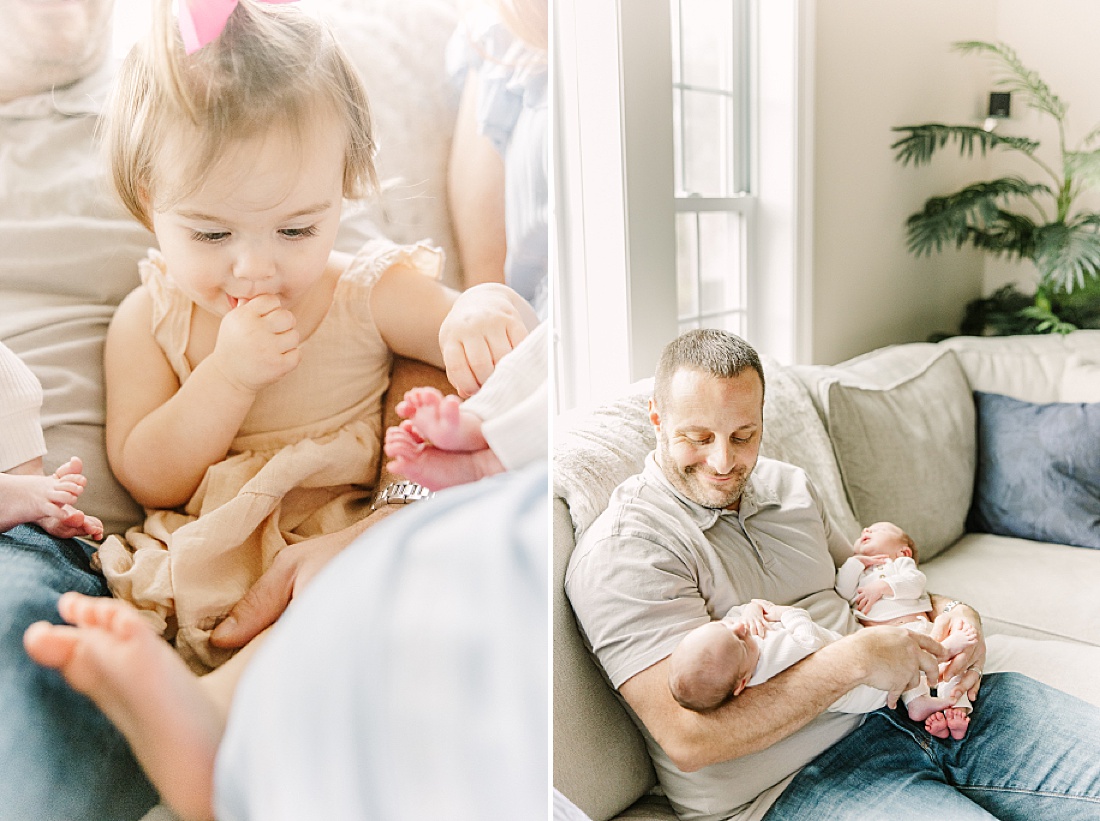 dad holds twins during twin newborn photo session in Natick Massachusetts with Sara Sniderman Photography