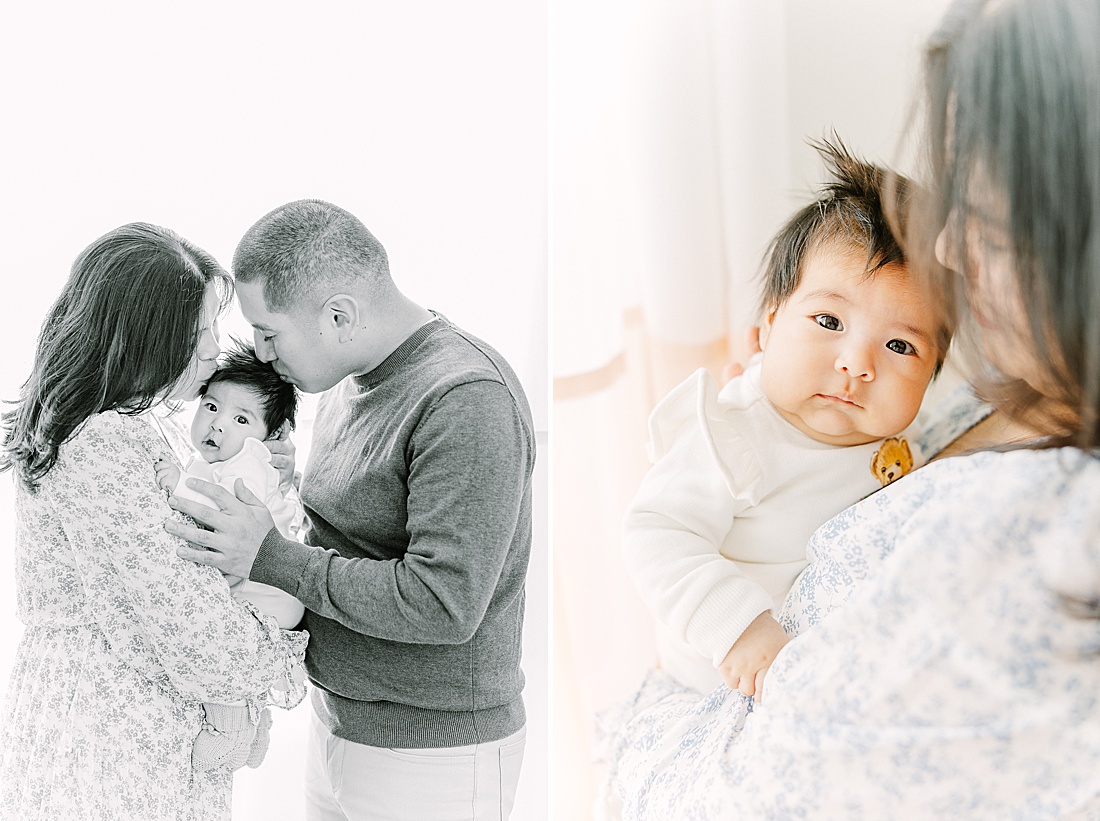 parents kiss babies head during studio lifestyle photo session with Sara Sniderman Photography in Natick Massachusetts