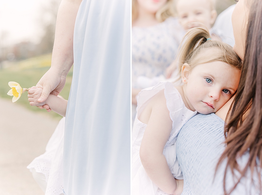 toddler cuddles with mom during first birthday photo session with Sara Sniderman Photography in Wellesley Massachusetts