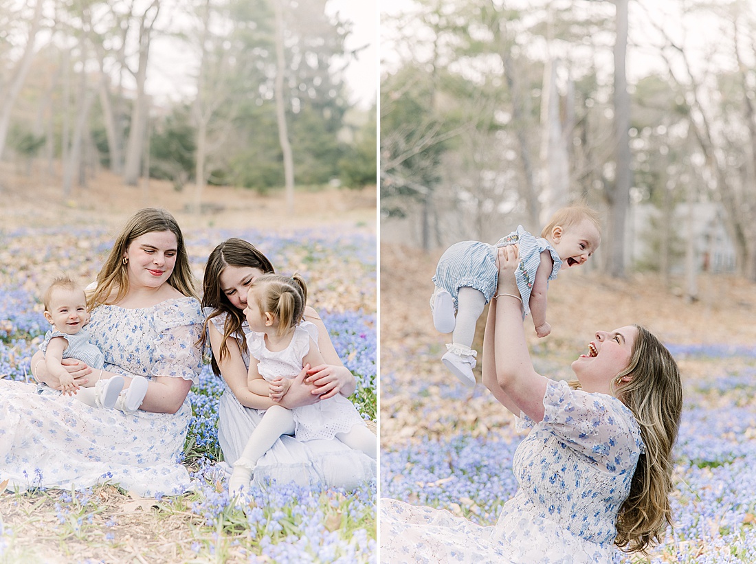 sisters cuddle in field of blue flowers during first birthday photo session with Sara Sniderman Photography in Wellesley Massachusetts