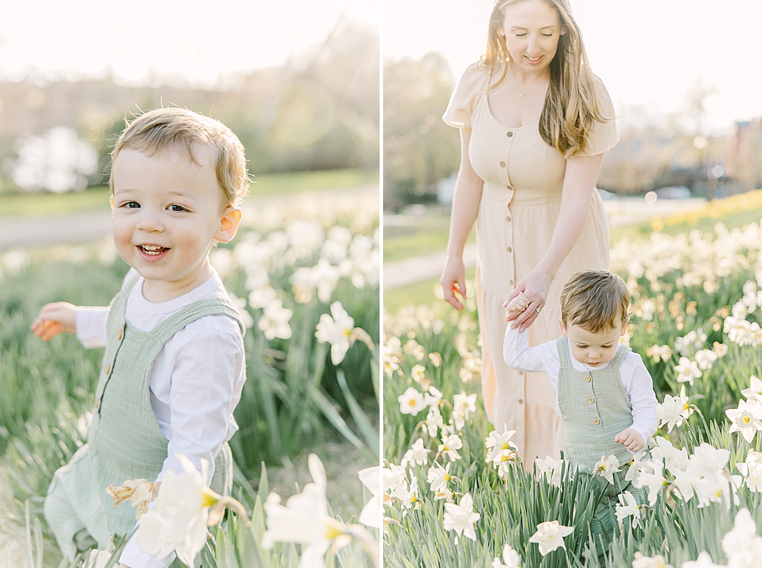 mother and son walk through daffodil field uring family photo session with Sara Sniderman Photography at Wellesley College.