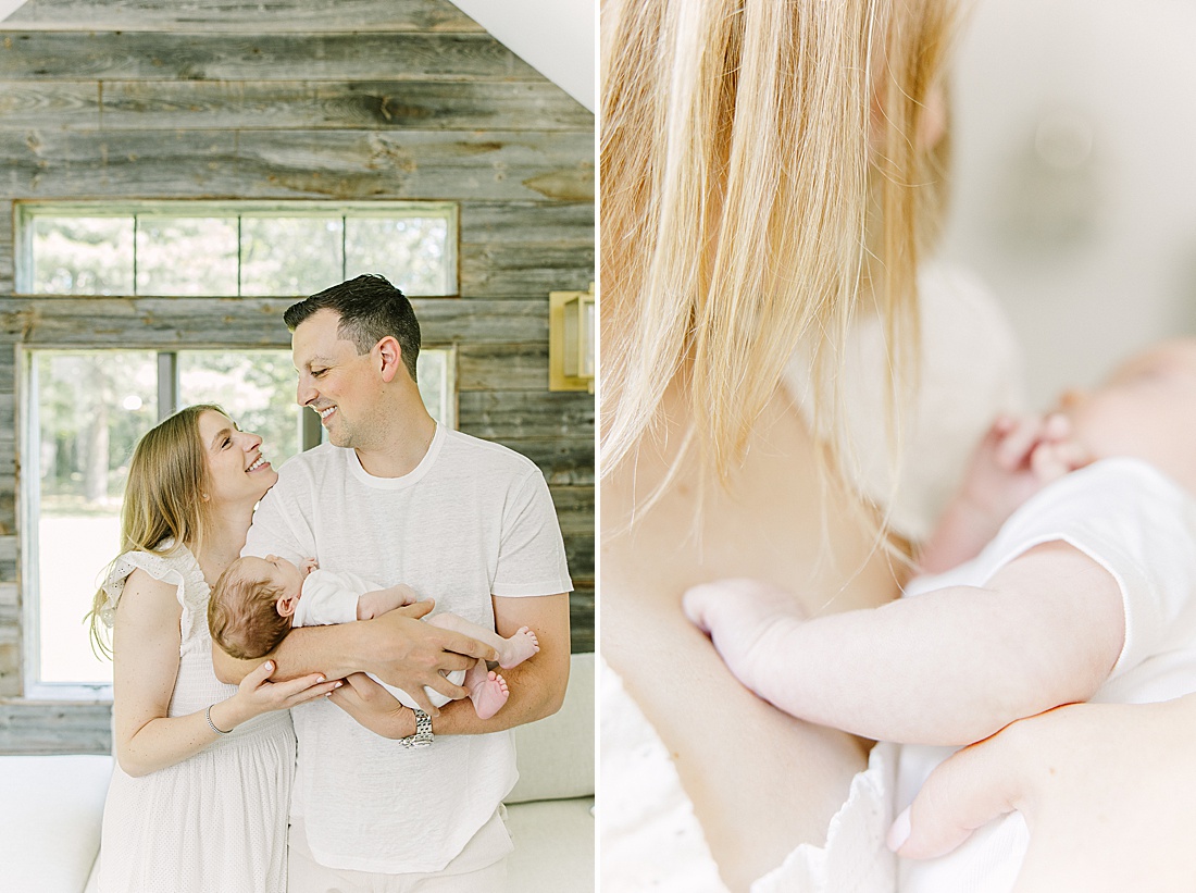 parents hold baby in living room during in-home newborn photo session with Sara Sniderman Photography in Natick Massachusetts