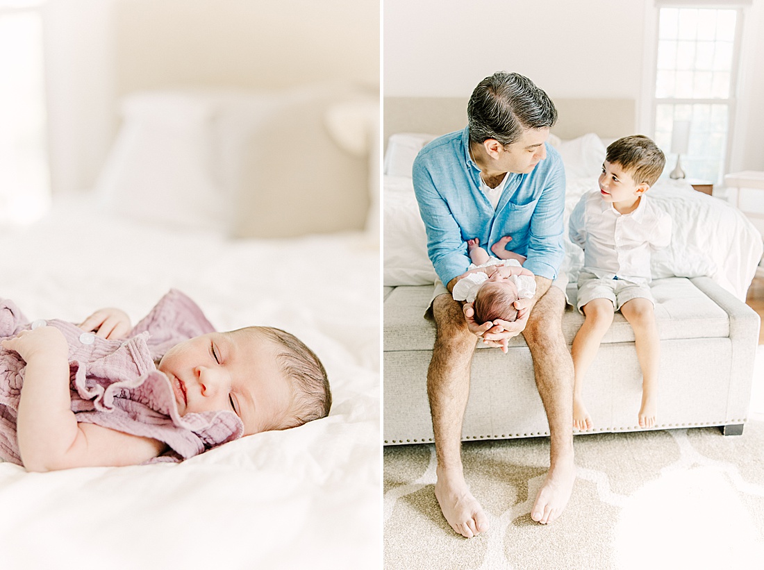 father and big brother sit on edge of bed holding baby during in-home newborn photo session with Sara Sniderman Photography in Sherborn Massachusetts