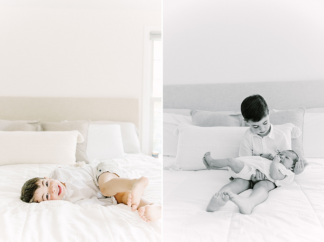 black and white of big brother holding baby during in-home newborn photo session with Sara Sniderman Photography in Sherborn Massachusetts