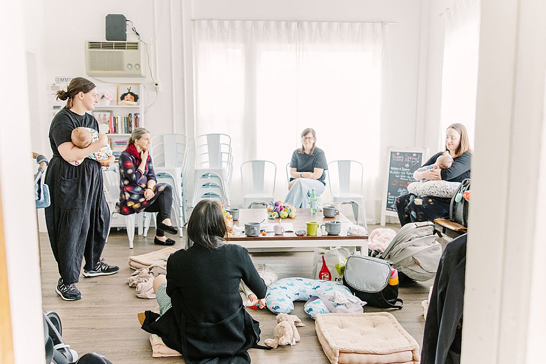 moms sit around talking during Chickadee and Hen Post partum mom group at DanceFit Natick Massachusetts