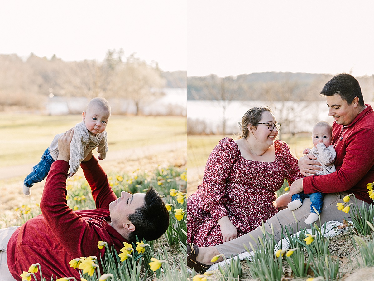 Parents sit with baby during spring family photo session with Sara Sniderman Photography in Wellesley MA